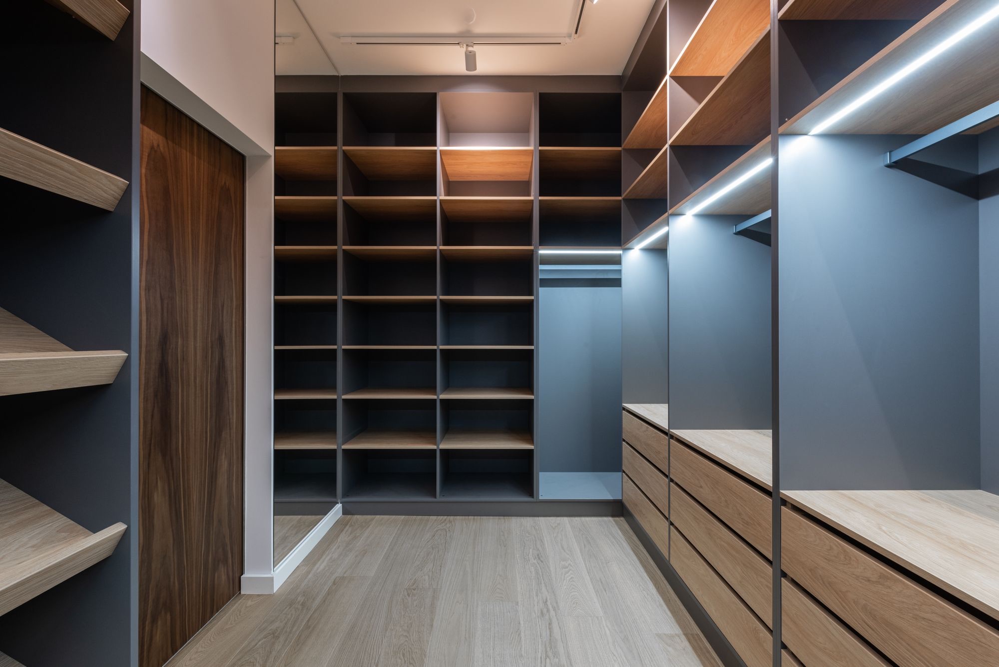 Closet with integrated LED lighting and open shelving