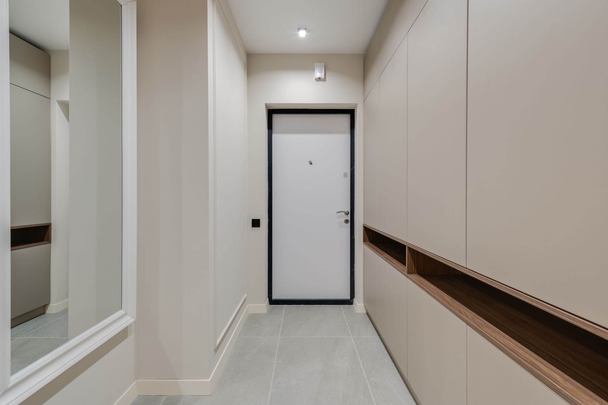 Full-height entry cabinetry in a modern hallway